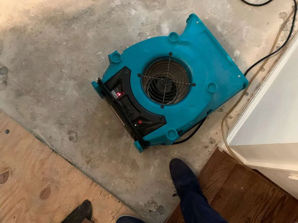 Air mover drying subfloor during Leak Detection & Repair in Hooksett